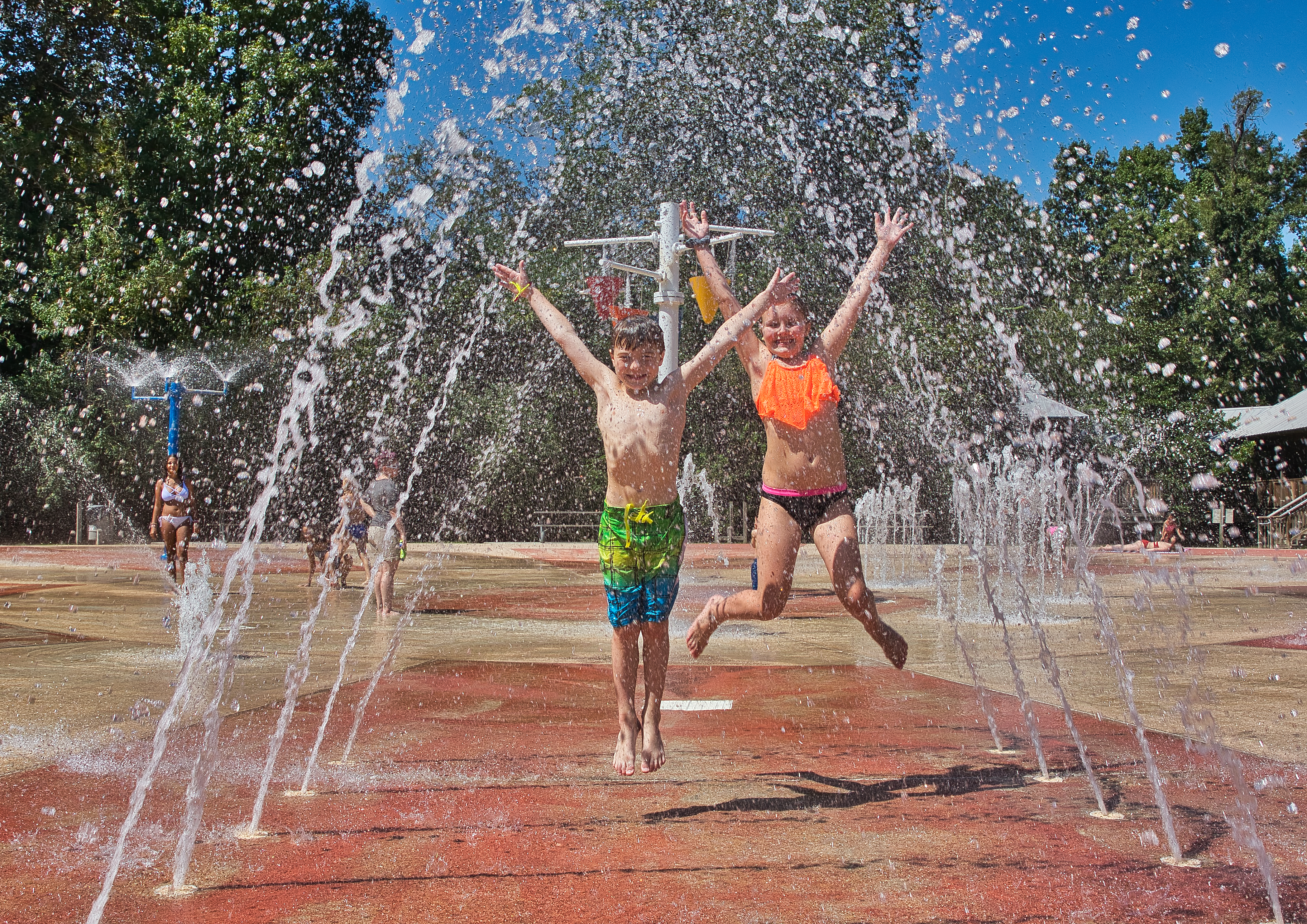 kids playing at a water playground