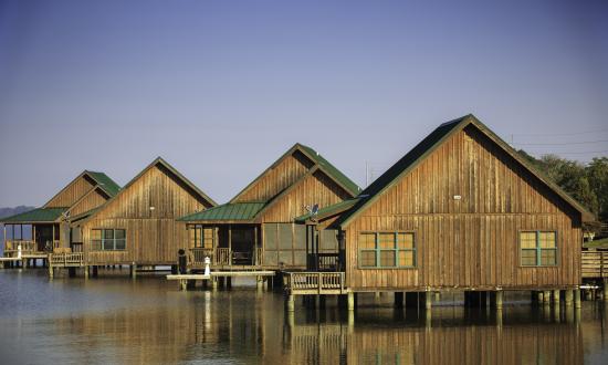 Modern cabins sit over Poverty Point Reservoir